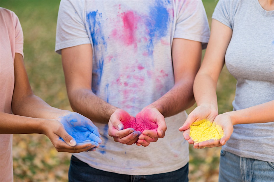 Family Colour Run - picture of3 people's hands holding safe, colourful dyed powder